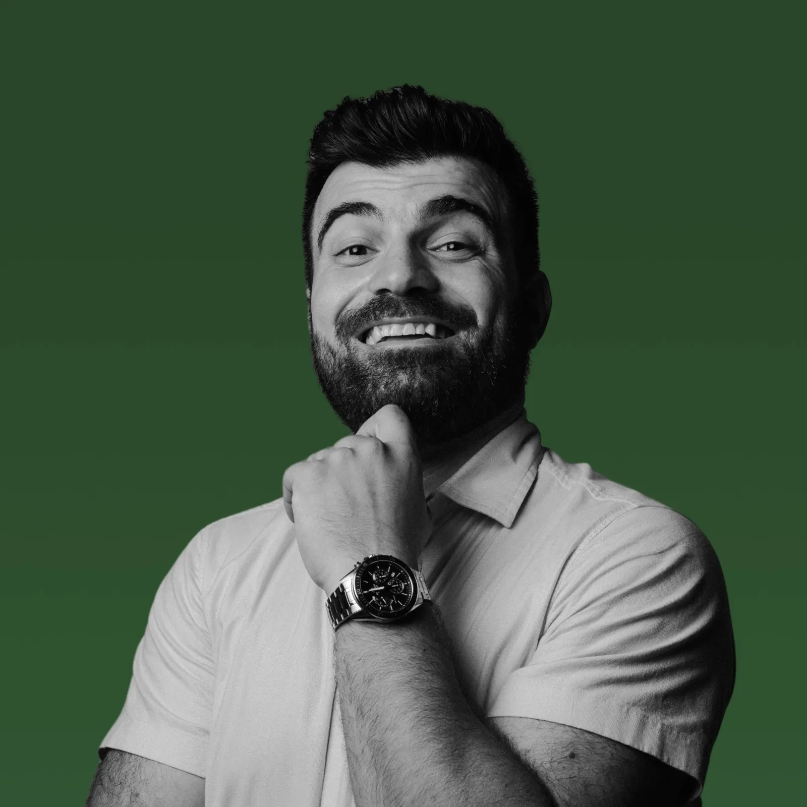 Shiraz Tumasyan, photographed in black and white against a green background